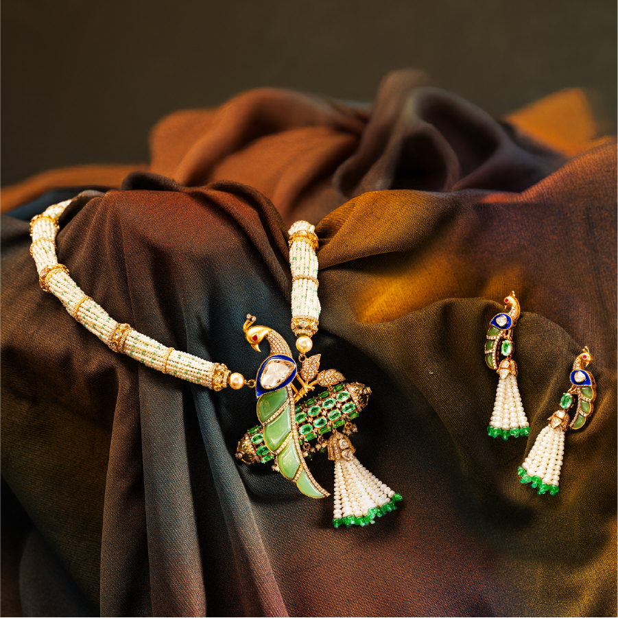 Peacock necklace and matching earrings on silk